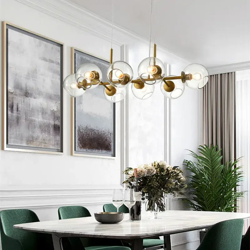 Modern brass glass ball pendant light with clear glass globe shades ideal for kitchen decor and pendant lights collection