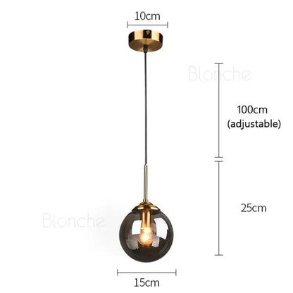 Modern brass glass ball pendant lights with dark smoked glass globe and polished brass accents for dining room decorbites