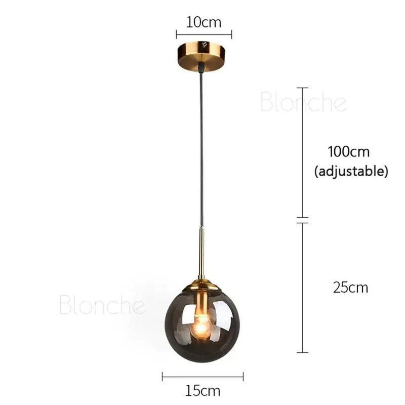 Modern brass glass ball pendant lights with dark smoked glass globe and polished brass accents for dining room decorbites