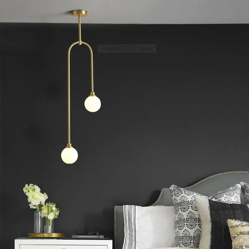 Modern brass glass ball pendant lights feature gold-toned metal and frosted globes for elegant dining room decorbites glass ball