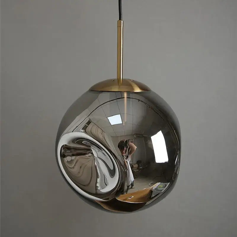 Modern brass glass ball pendant lights set of 2 featuring sleek chrome spherical glass ball pendants with brass rods
