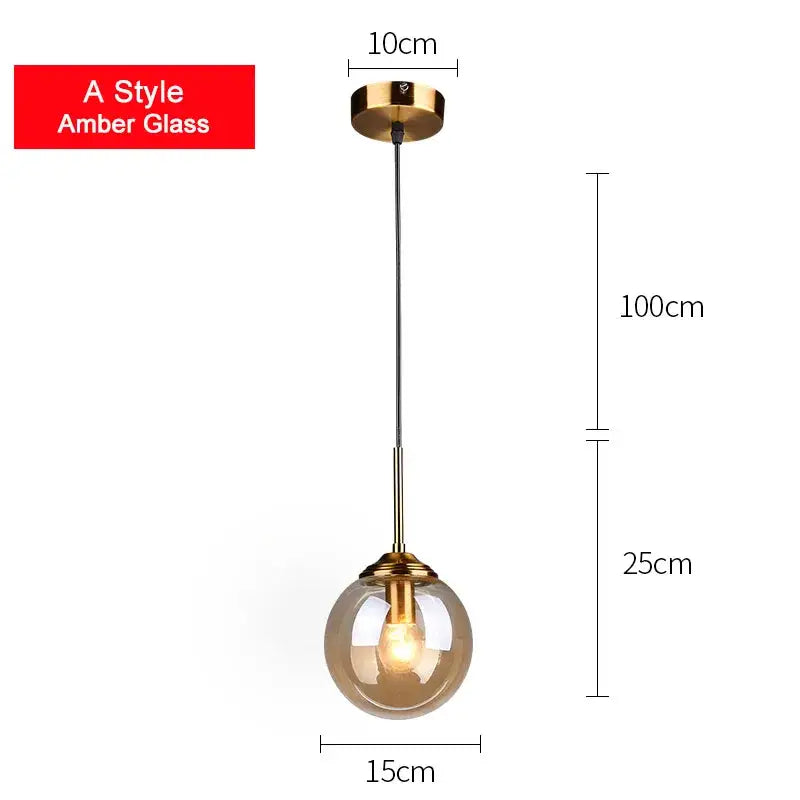Modern brass glass ball pendant set featuring an amber decorbites glass ball pendant with gold-finished fixture for bedroom lighting