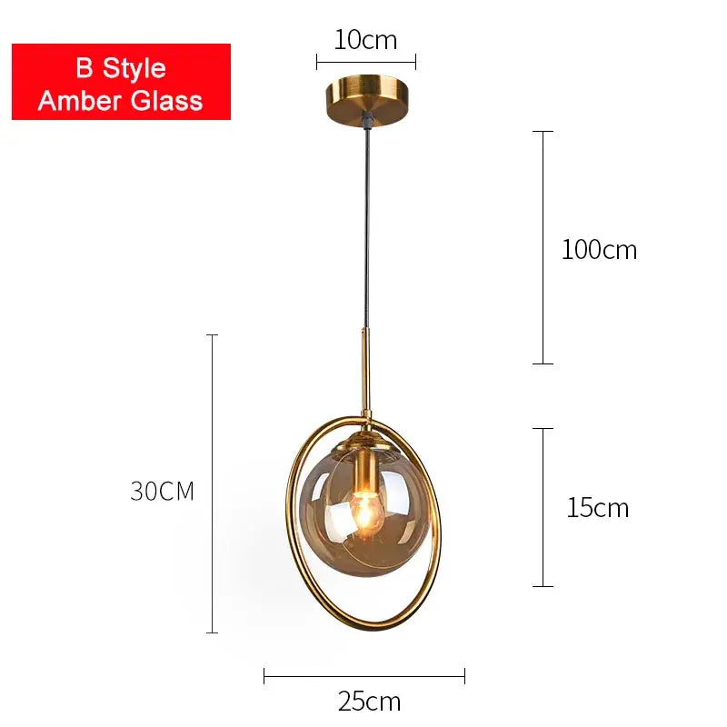 Modern brass glass ball pendant set featuring a gold-toned decorbites glass ball pendant with amber globe and circular frame