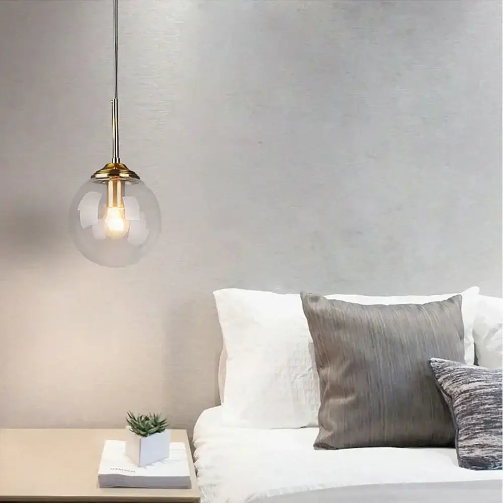 Modern brass glass ball pendant set bedroom lighting featuring a clear glass decorbites glass ball pendant fixture