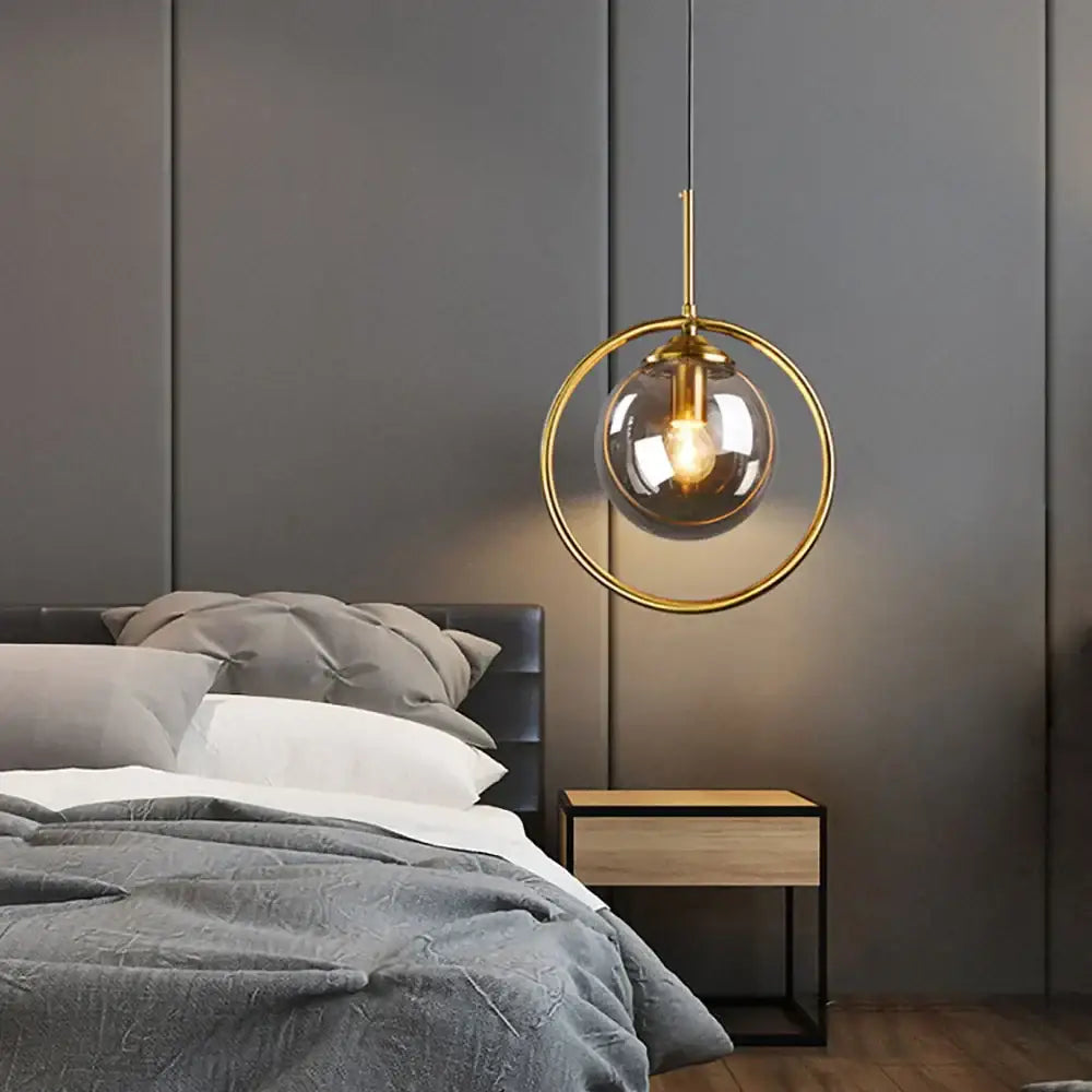 Modern brass glass ball pendant set bedroom lighting with gold-toned metal frame and clear decorbites glass ball pendant