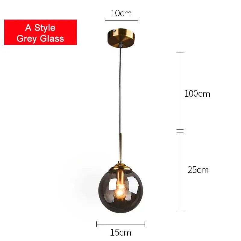 Modern brass glass ball pendant set featuring a sleek grey decorbites glass ball with brass metal accents for bedroom lighting