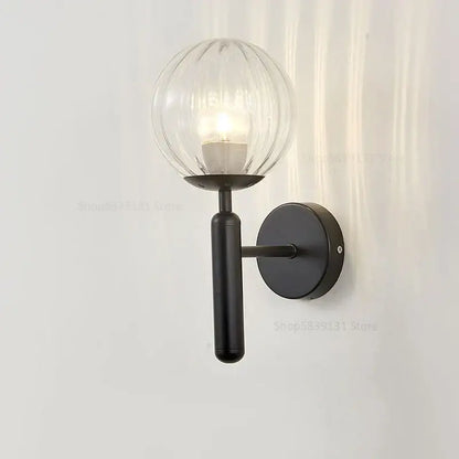 Black metal wall lamp with ribbed glass globe shade by decorbites glass ball for modern bedroom decor