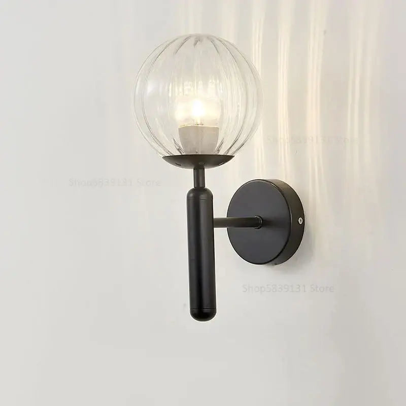 Black metal wall lamp with ribbed glass globe shade by decorbites glass ball for modern bedroom decor