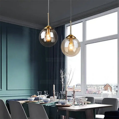 Two modern brass glass ball wall lamps with gold finish and translucent glass ball shades for bedroom decorbites glass ball lighting