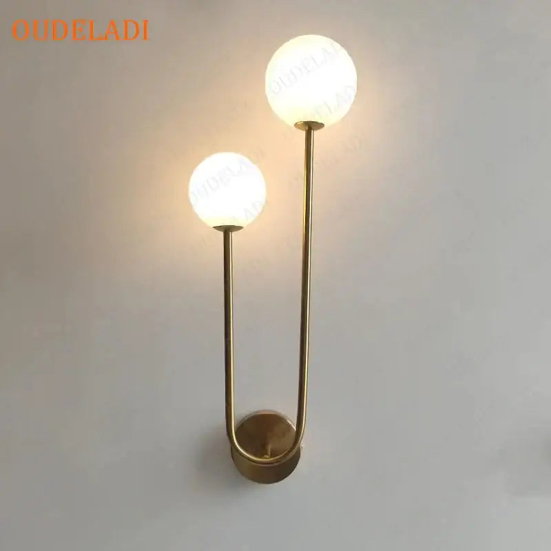 Modern brass glass ball wall sconce with two frosted glass globes for bedroom led lighting decorbites brass glass