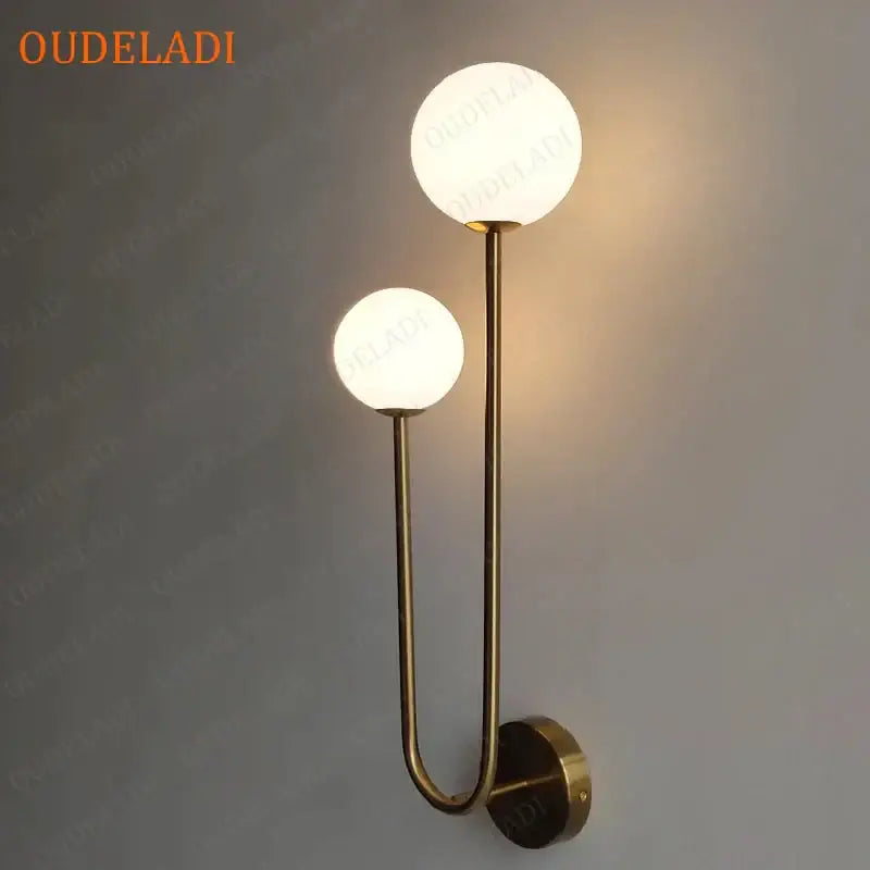 Modern brass glass ball wall sconce with brass finish and two frosted glass globe shades for bedroom led light decorbites brass glass