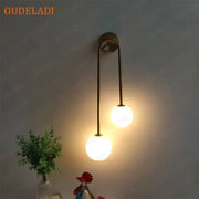Modern brass glass ball wall sconce with two frosted glass globes for bedroom decorbites brass glass lighting