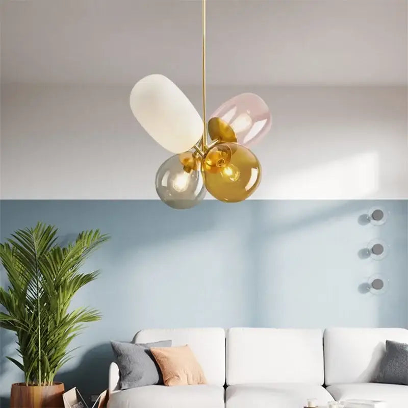 Modern brass glass balloon chandelier with brass frame and four white pink amber and gray glass globes for living room decorbites glass balloon