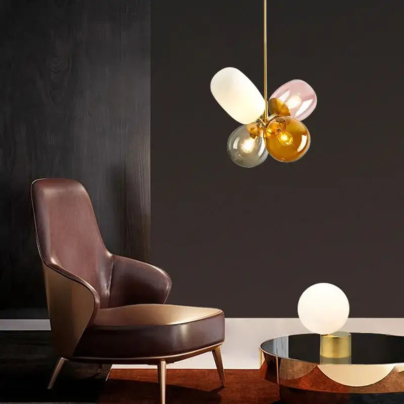 Modern brass glass balloon chandelier with four colorful glass globes in white pink gold and gray for living room decorbites glass balloon design