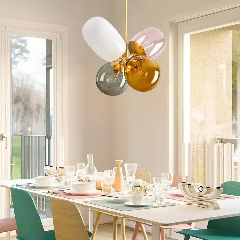 Modern brass glass balloon chandelier with four colorful translucent globes in white pink amber and gray by decorbites glass balloon