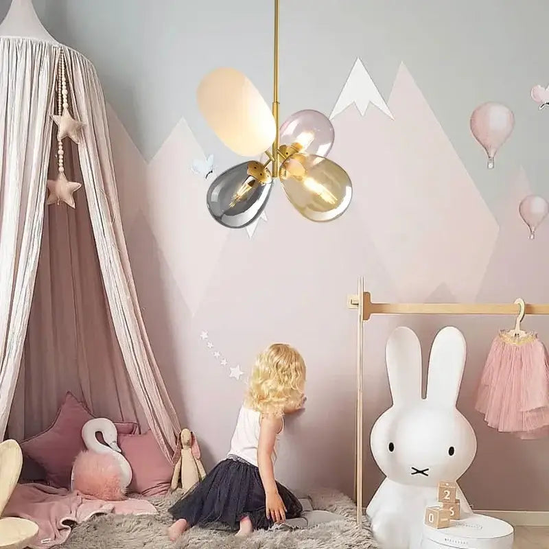Modern brass glass balloon chandelier with gold metal frame and pastel glass shades for child play area decorbites glass balloon