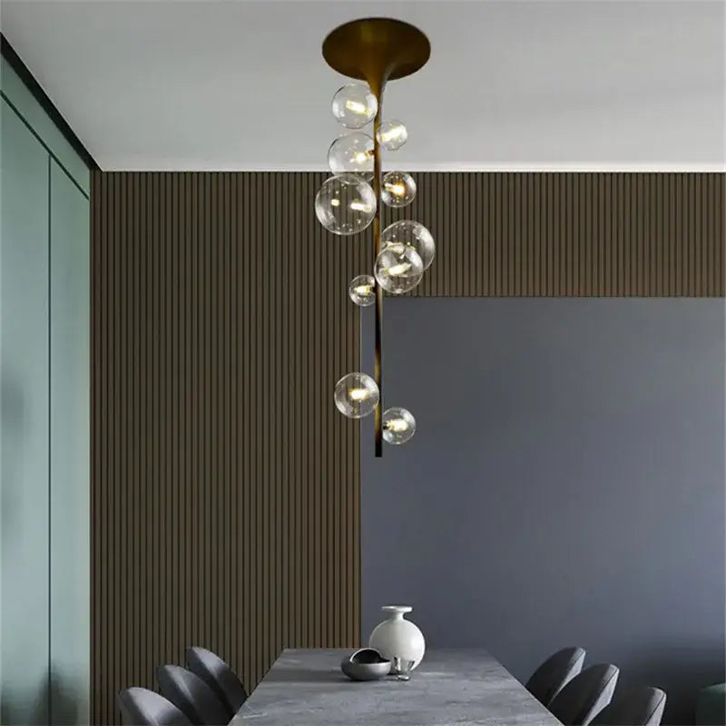 Modern brass glass bubble pendant light with clear glass spheres cascading for dining room decorbites pendant light