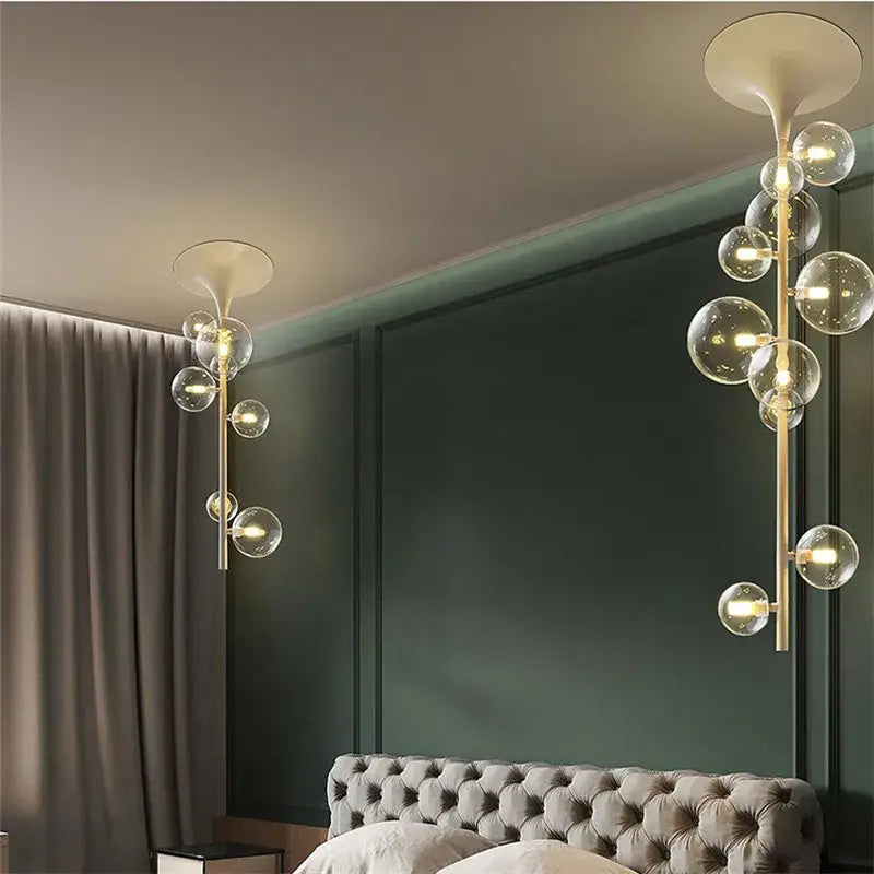 Modern brass glass bubble pendant light with gold-toned frame and clear glass bubble bulbs for dining room pendant light decorbites glass bubble