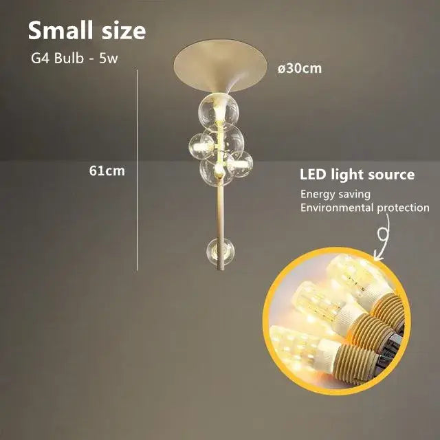 Modern brass glass bubble pendant light with sleek metallic finish and five clear glass globe bulbs in vertical cascade