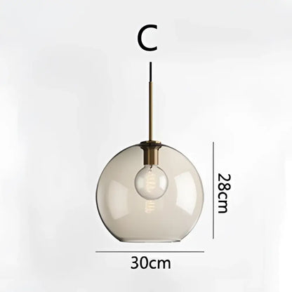 Modern brass glass chandelier featuring a spherical glass pendant light with exposed bulb for dining room decorbites glass chandelier