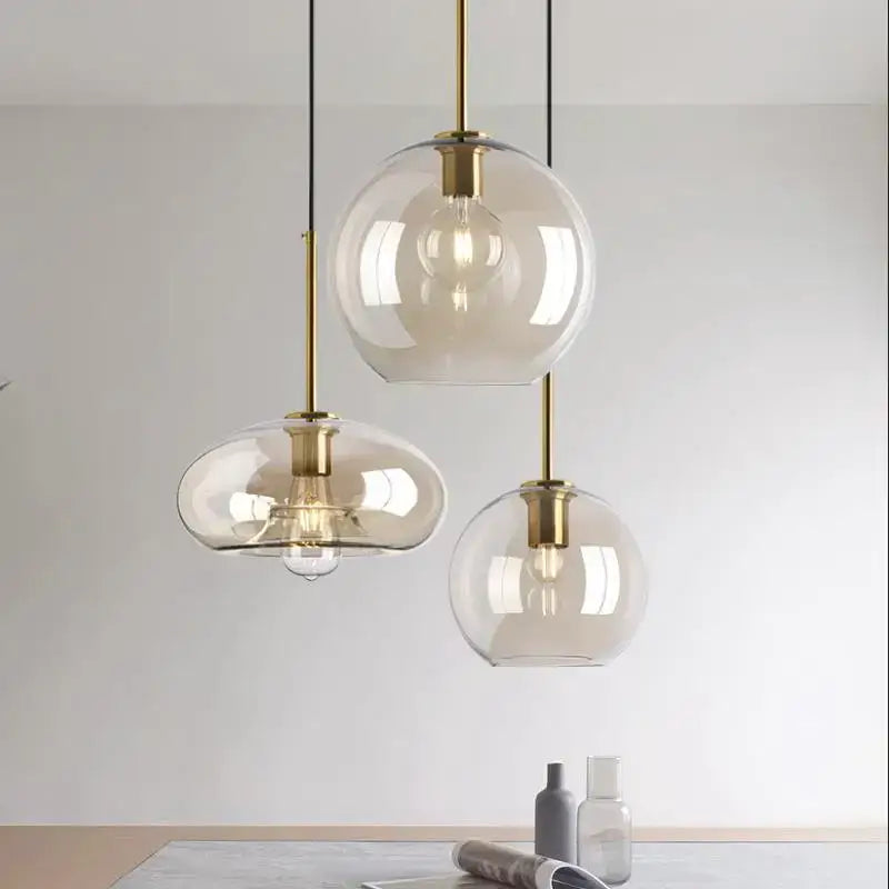 Three modern glass chandelier pendant lights with brass accents and exposed filament bulbs for dining room decorbites glass chandelier