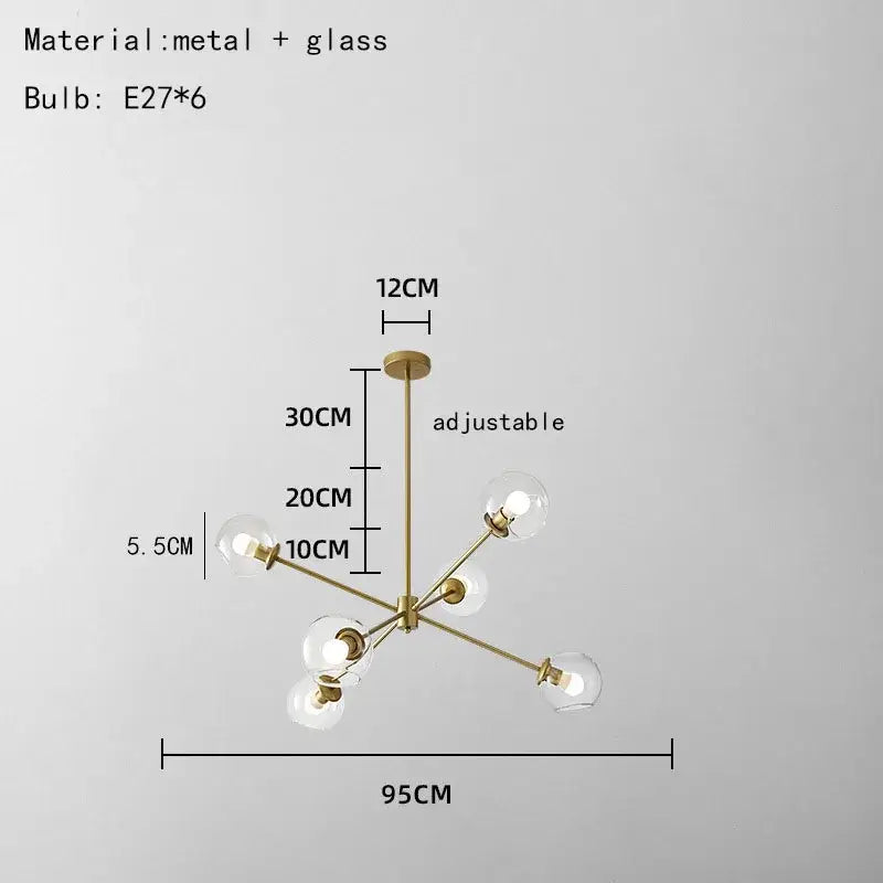 Modern brass glass chandelier with six spherical bulbs and clear glass shades for elegant dining room living spaces