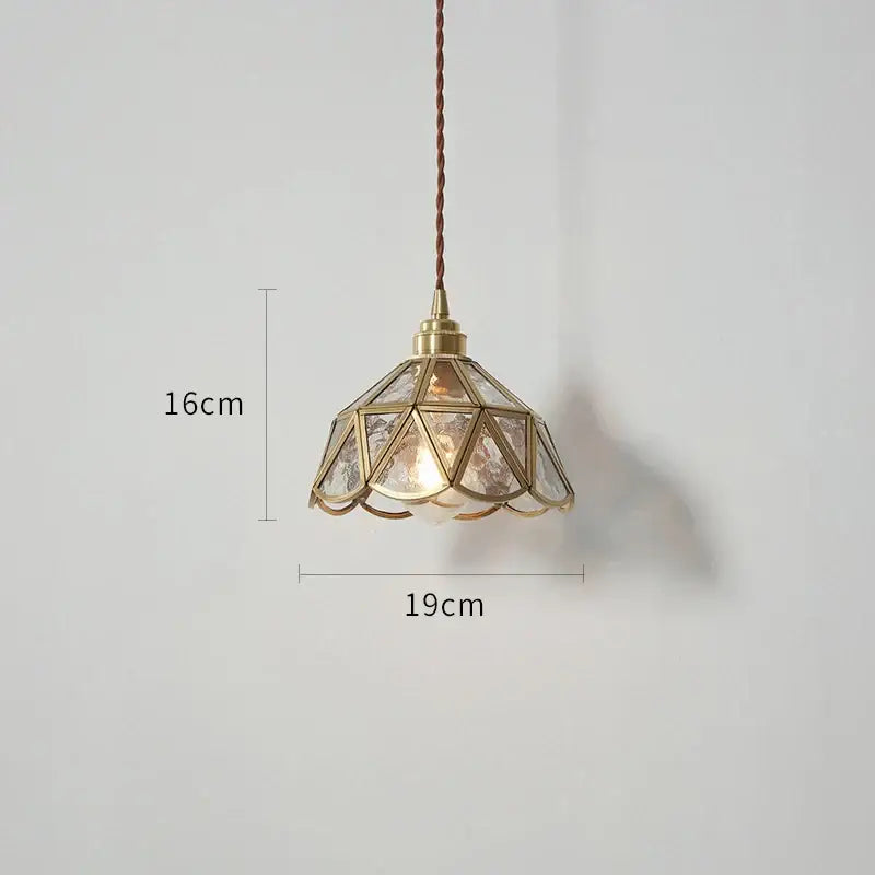 Vintage-style brass and clear glass copper led pendant light with geometric petal design for dining room use
