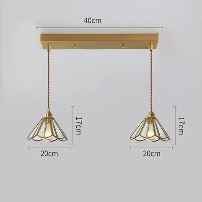Modern brass glass copper led pendant lights featuring delicate wireframe shades and exposed bulbs for dining room use