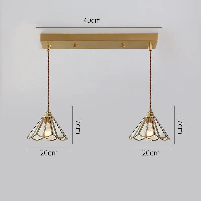 Modern brass glass copper led pendant lights featuring delicate wireframe shades and exposed bulbs for dining room use