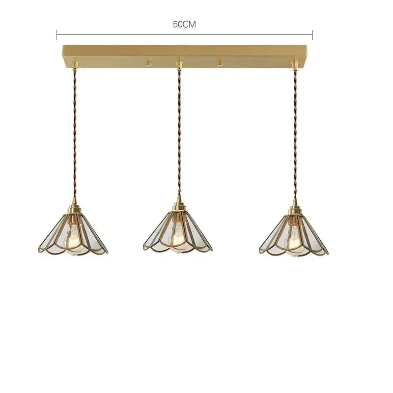 Modern brass glass copper led pendant lights with gold-toned bell-shaped glass shades and twisted copper cords for dining room