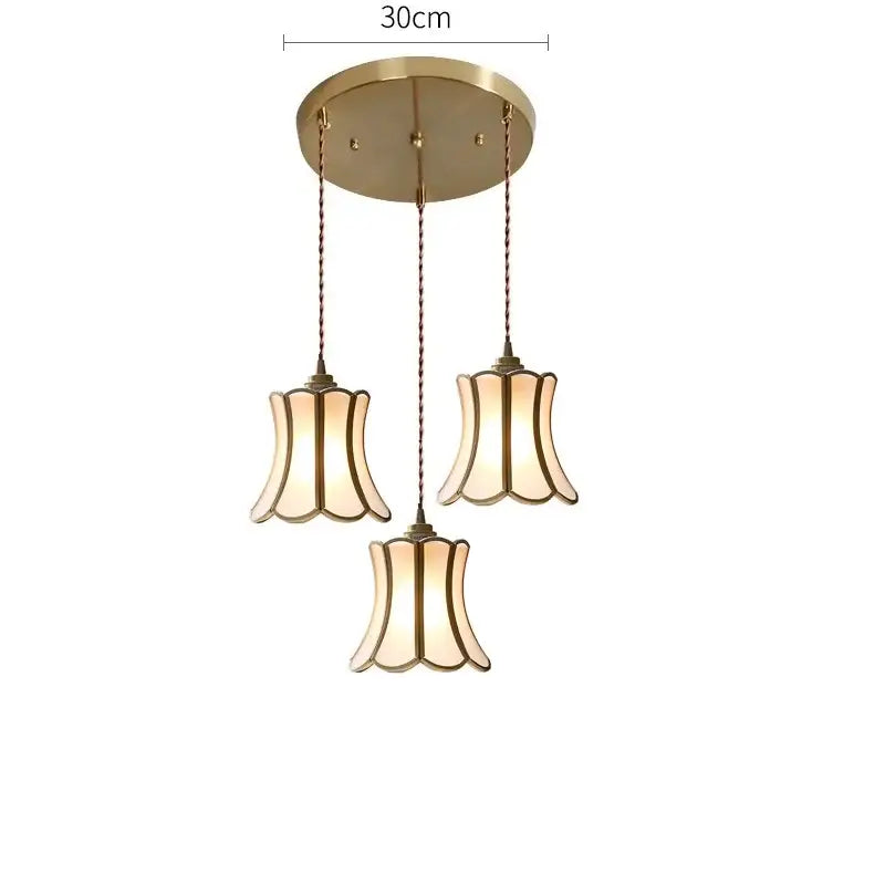 Modern brass glass copper led pendant lights with gold-toned three-light fixture and fluted warm glass shades