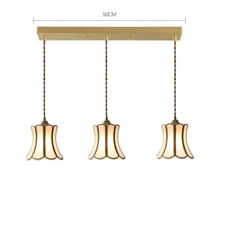 Modern brass glass copper led pendant lights with gold-toned fluted shades and twisted bronze cords for dining room