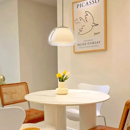 A sleek modern brass glass jelly pendant lamp with clear glass shade and warm glow for dining room decorbites pendant lamp
