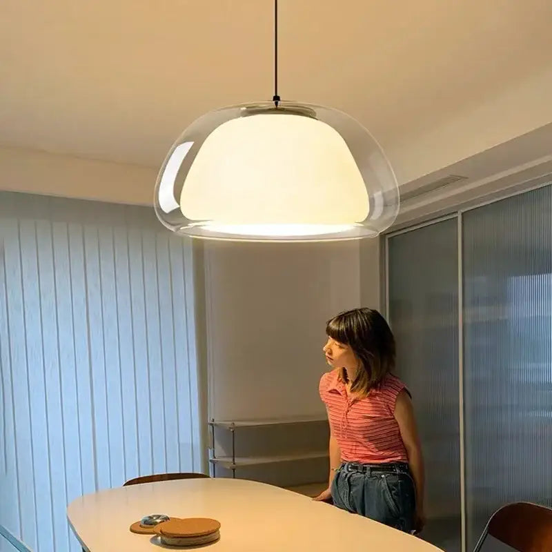 Modern brass glass jelly pendant lamp with translucent glass jelly pendant and sleek black suspension cord for dining room decorbites