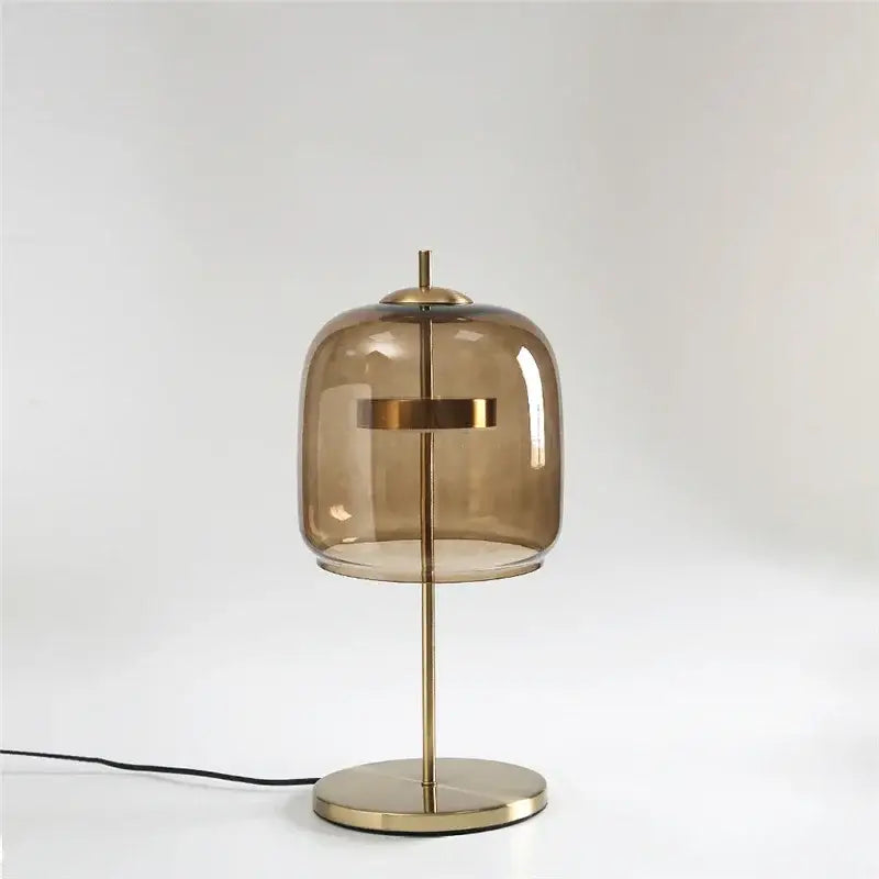 Modern brass glass lampshade led table lamp with translucent amber dome for bedroom decor by decorbites