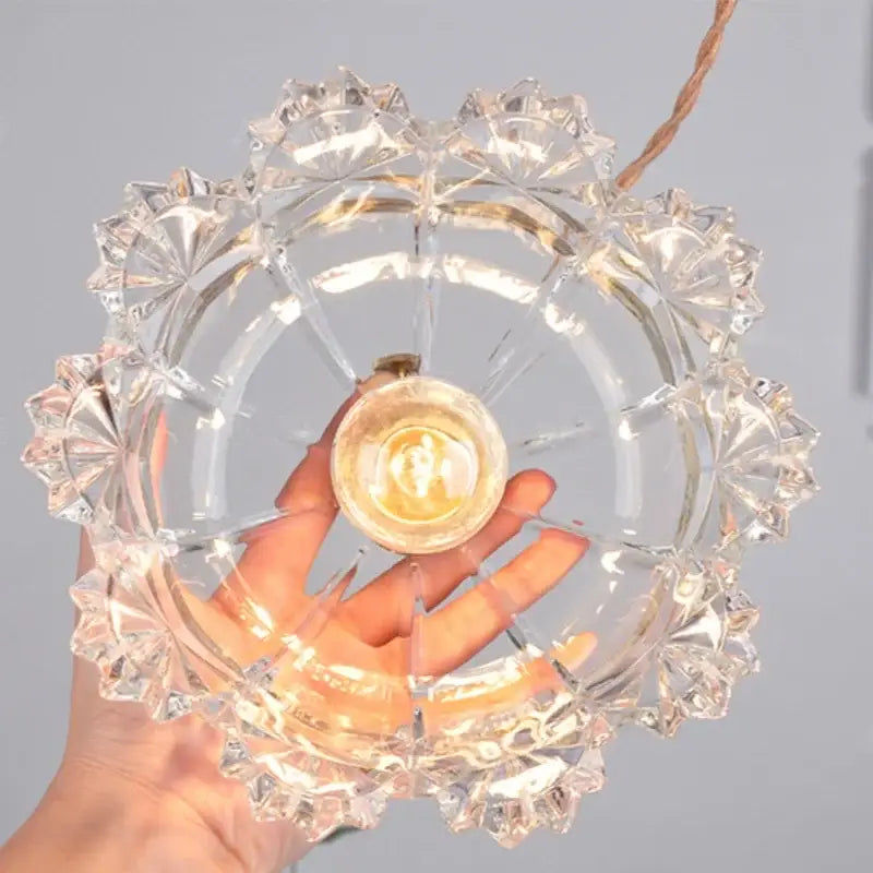 Modern brass glass led pendant light featuring clear faceted glass and a brass bulb holder for dining room decorbites brass glass