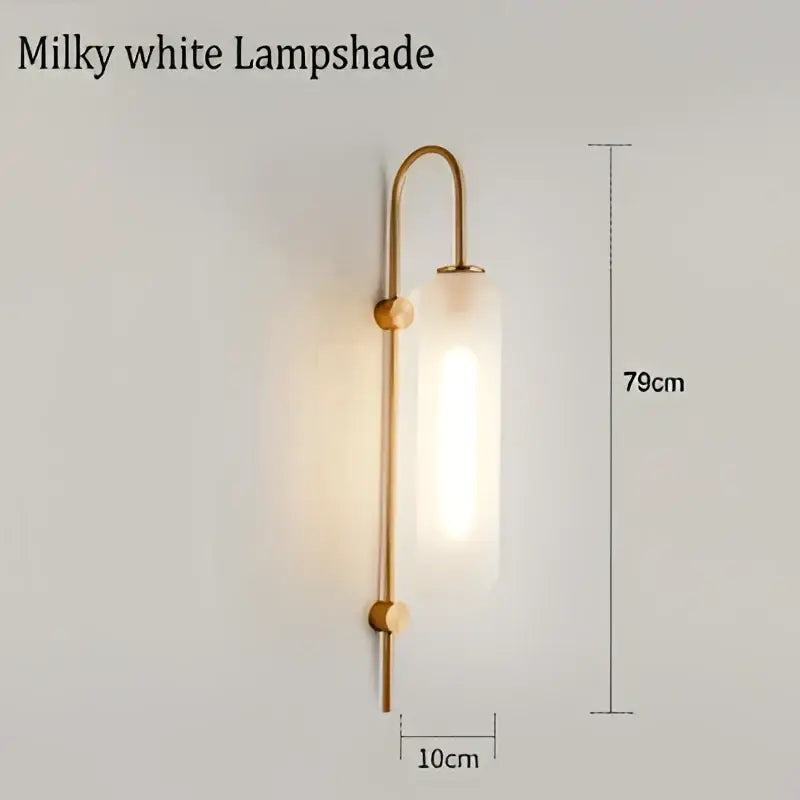 Modern brass glass sconce wall lamp with milky white glass lampshade and curved brass frame for living room wall lamp