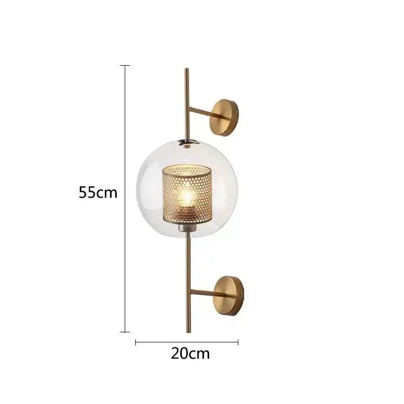 Modern brass glass wall lamp with gold-toned sconce and perforated lantern-style bulb holder for bedroom decorbites brass glass