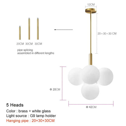Modern brass globe pendant lamp with five frosted glass spheres clustered for dining room illumination