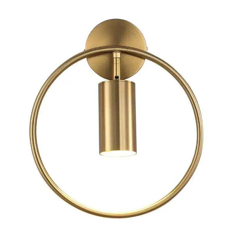 Modern brass gold adjustable led wall sconce with a sleek cylindrical light and circular ring frame for corridor use