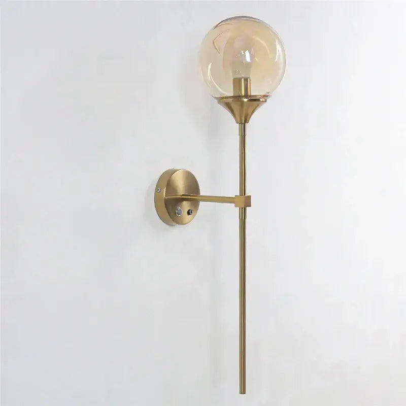 Modern brass golden glass wall sconces with a spherical amber globe for bedroom decorbites golden glass wall lighting