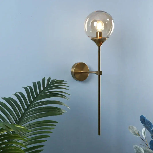 Modern brass golden glass wall sconce with spherical glass globe and exposed bulb for bedroom decorbites golden glass lighting