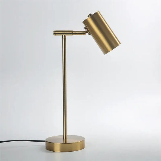 Brass-finished adjustable table lamp with cylindrical shade and slender stem for modern decorbites golden table lamp decor