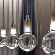 Modern brass honeycomb crystal ball led pendant light with clear glass globe and metal fixture for dining room decorbites