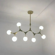 Modern brass iron magic molecular pendant lights with six glowing white spherical bulbs for dining room decorbites