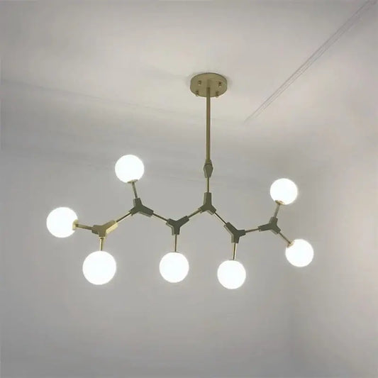 Modern brass iron magic molecular pendant lights with six glowing white spherical bulbs for dining room decorbites