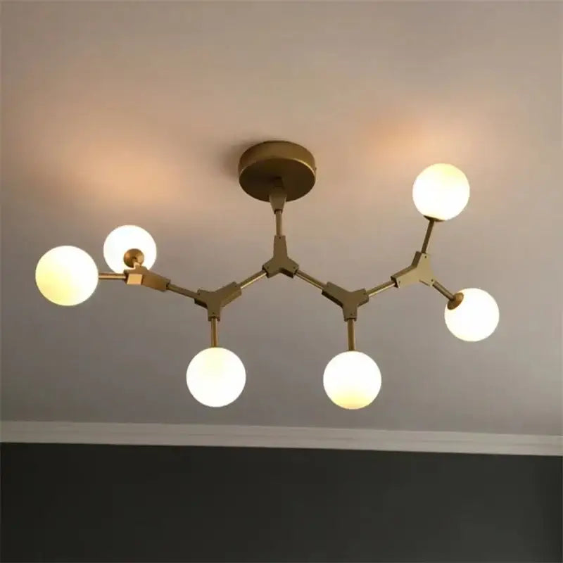 Modern brass iron magic molecular pendant lights with five glowing spherical glass bulbs for dining room decorbites design