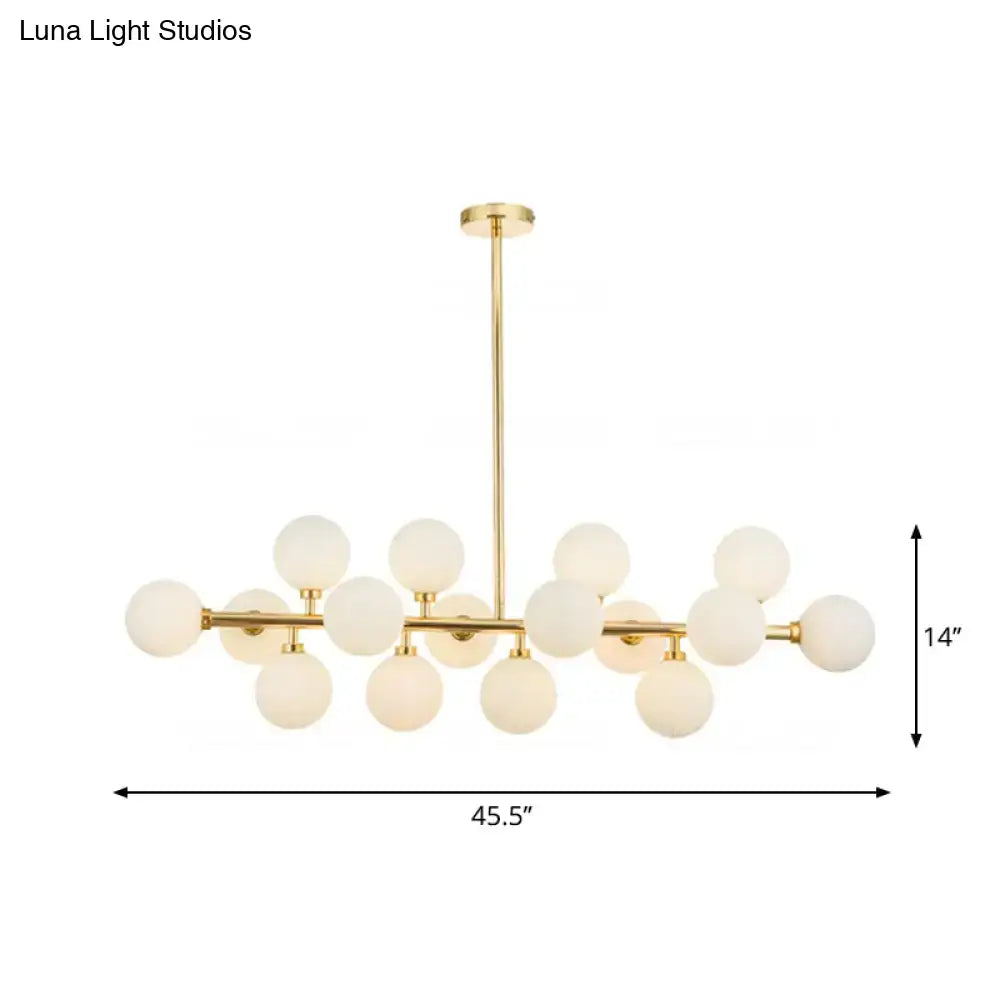 Gold-toned contemporary brass island chandelier with 16 frosted glass globes for elegant brass island lighting fixture