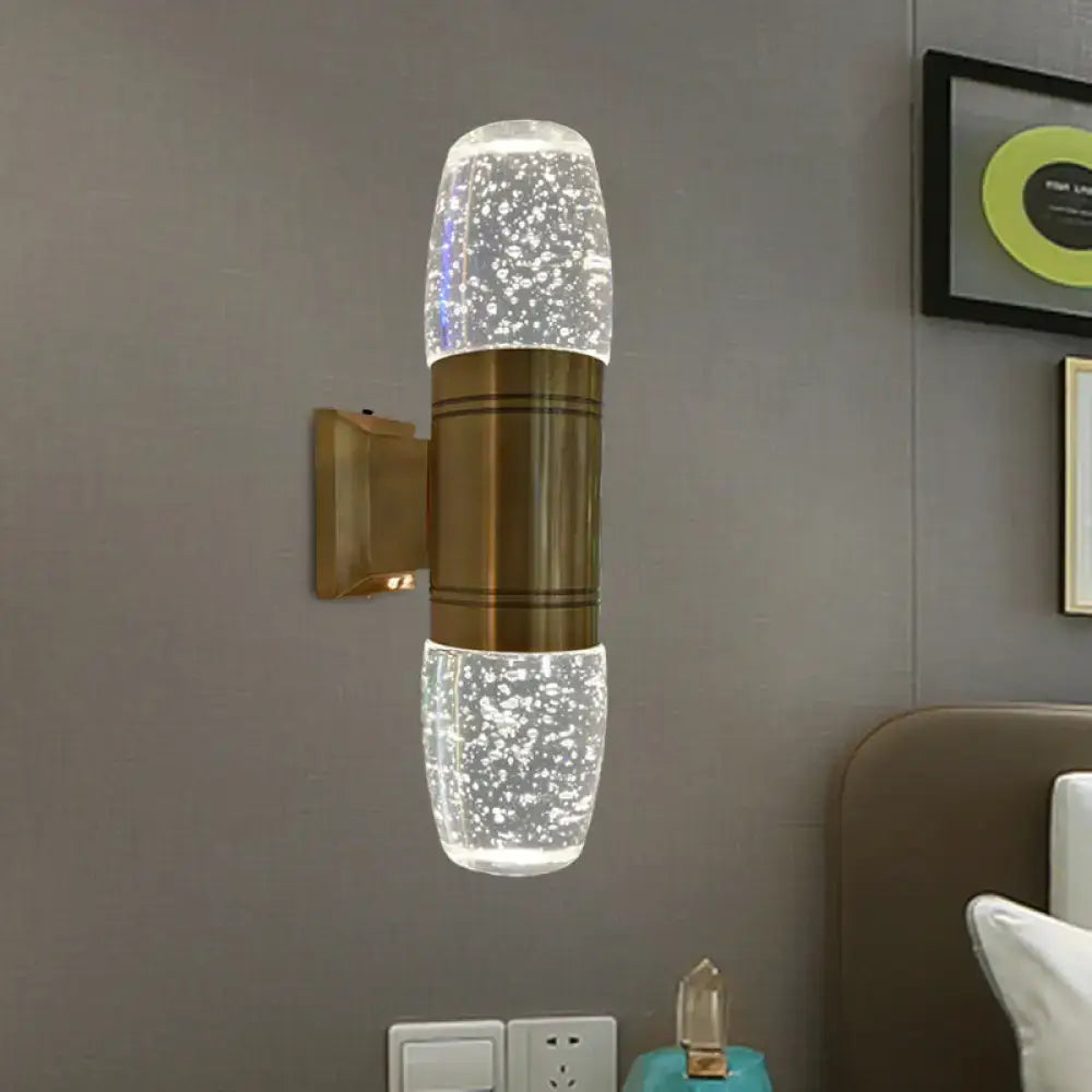 Modern brass led crystal wall sconce light with bubble glass sections and soft white light for bedroom use
