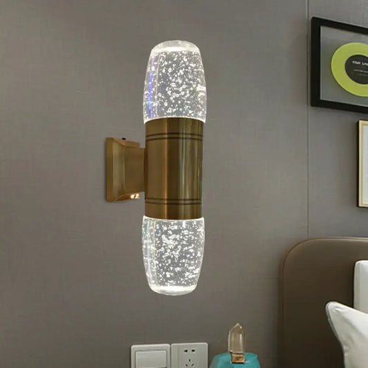 Modern brass led crystal wall sconce light with bubble glass sections and soft white light for bedroom use
